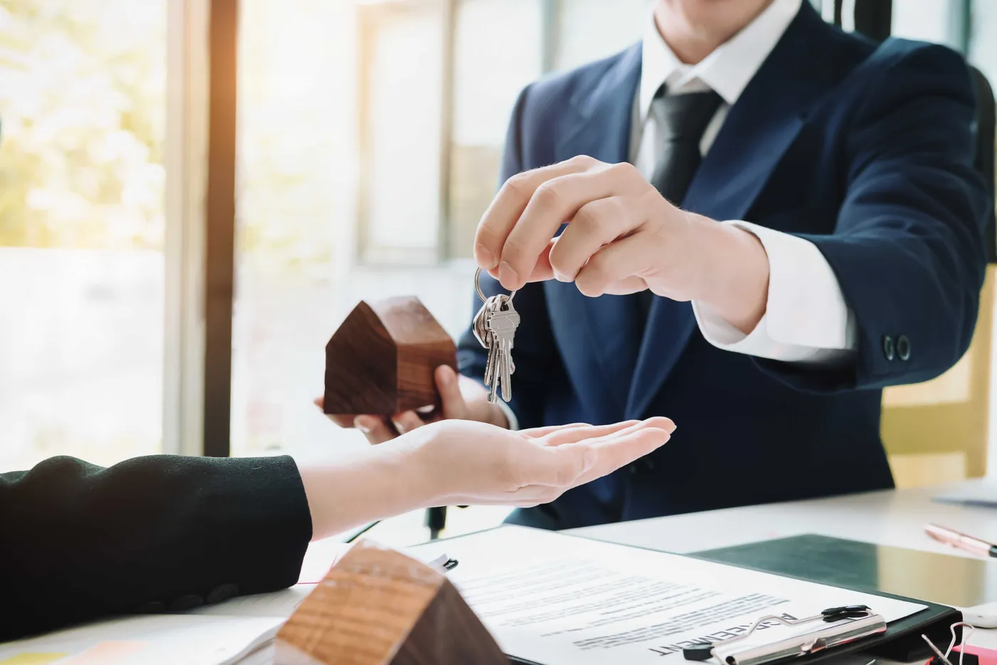 Keys to a Spanish property being handed over across a desk